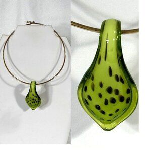 Gold-tone omega chain with green glass pendant.